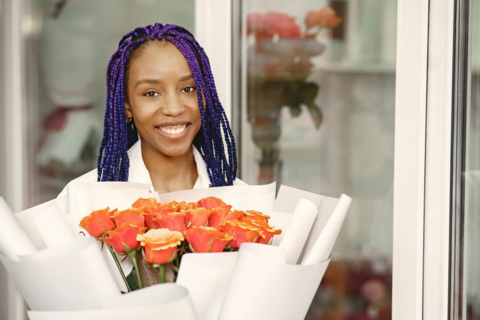 Professional floral arrangement being created on-site at an outdoor venue